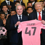 Lionel Messi and Inter Miami players standing with US President Donald Trump during a White House ceremony celebrating their 2025 MLS Cup triumph.