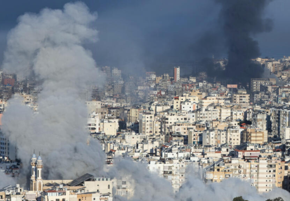 Destroyed buildings and smoke in Beirut’s southern suburbs following Israeli airstrikes during the escalating Middle East war.